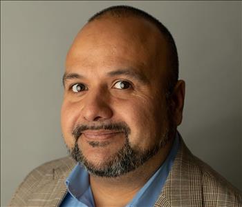 Man in brown coat  smiling